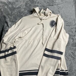 A cream elongated hoodie